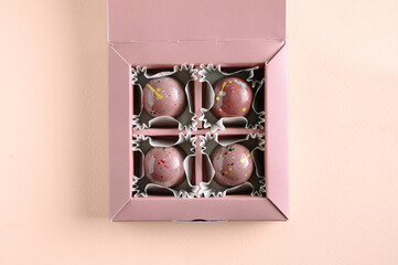 Handmade chocolates and candies on a bright colored background