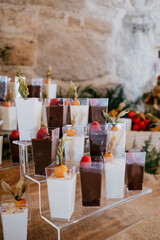 Glasses filled with cream and fruits