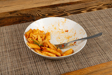 Pasta Leftovers, Unfinished Meal on Dirty Plate, Uneaten Lunch Leftover, Macaroni, Smeared Sauce on White Plate