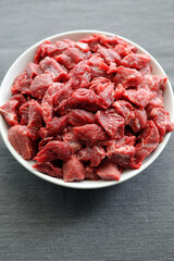 Fresh, raw beef cut into pieces, prepared for goulash - 586472255