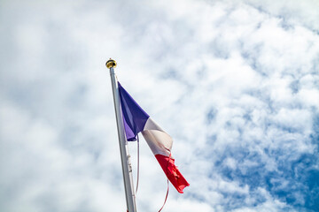 Frazzled flag of France waving in the wind