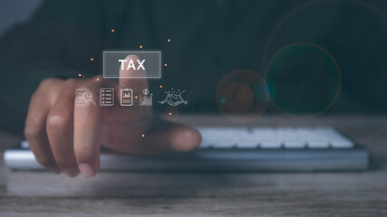 Businessman using computer to complete Individual income tax return form online for tax payment.