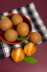 Sapodilla fruit (Manilkara zapota) and other names such as sapota, chikoo, chico, naseberry, or nispero. Sapodilla is tropical fruit evergreen tree and sweet taste fruit