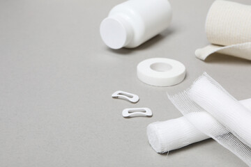 First aid kit supplies on gray background