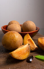 Sapodilla fruit (Manilkara zapota) and other names such as sapota, chikoo, chico, naseberry, or nispero. Sapodilla is tropical fruit evergreen tree and sweet taste fruit