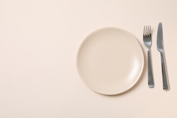 Minimal table setting with blank dish, space for text