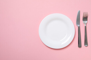 Minimal table setting with blank dish, space for text