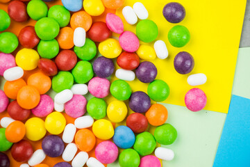 Skittles candy on the colorful table, colorful sweet candy