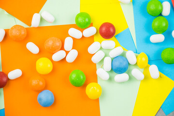 Skittles candy on the colorful table, colorful sweet candy