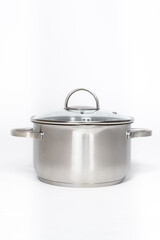 Stainless steel pot with glass lid and drain spout on a white background.