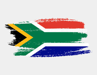 Obraz premium Artistic grunge brush flag of South Africa isolated on white background. Elegant texture of national country flag