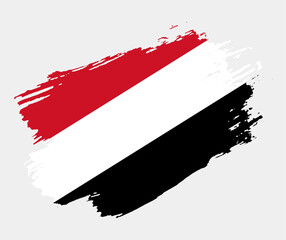 Artistic grunge brush flag of Yemen isolated on white background. Elegant texture of national country flag