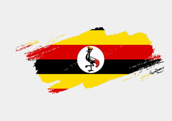 Artistic grunge brush flag of Uganda isolated on white background. Elegant texture of national country flag