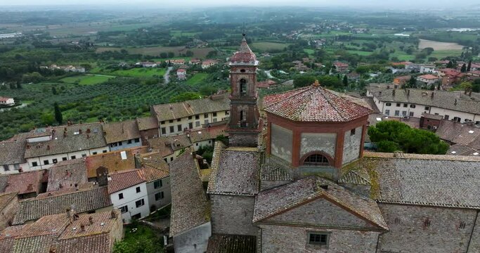 Historic San Michele Arcangelo Collegiate Church In Lucignano, Tuscany, Italy. - aerial