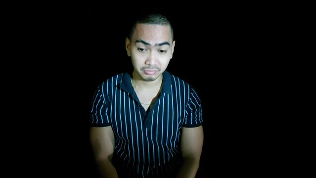 handsome young filipino man sadness