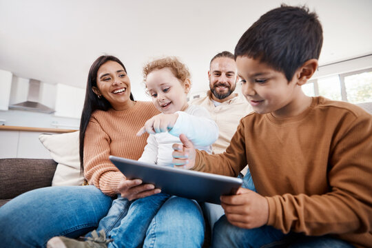 Happy, tablet and bonding with family on sofa for search, streaming and fun games. Technology, internet and connection with parents and children browsing online at home on social media app or website