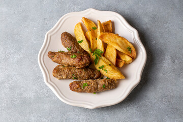 Traditional Turkish food; dry meatballs or inegöl meatballs with potatoes (Turkish name; Kuru kofte or anne koftesi)