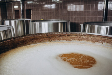 Brewery equipment. Brew manufacturing. Round cooper storage tanks for beer fermentation and...