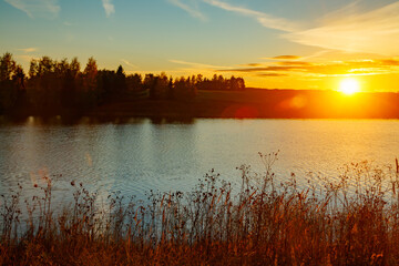 Fototapeta na wymiar Beautiful sunset on river Kymijoki at autumn, Finland.