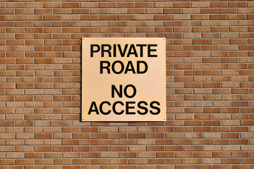 'Private Road No Access' Sign on Brick Wall 