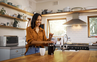 Kitchen, coffee and woman with French press for breakfast latte, cappuccino and hot beverage at...