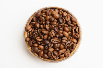 Coffee beans in wooden bowl isolated on white background