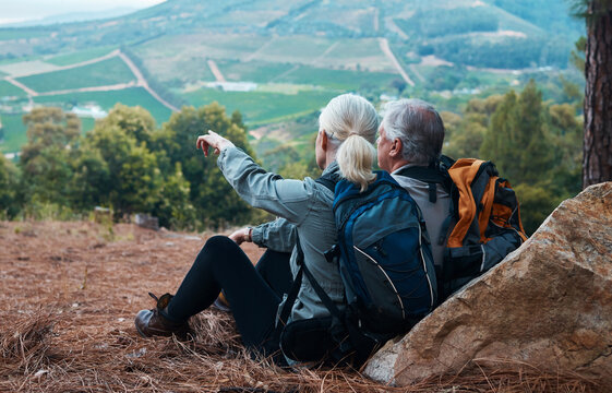 Mountains, retirement and hiking, old couple pointing at mountains in view on nature walk in Peru. Travel, senior man and woman relax on mountain cliff, hike with love and health on holiday adventure