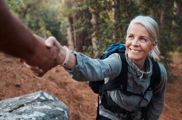 Hiking, helping hand and people in nature for climbing adventure, senior wellness and support for...