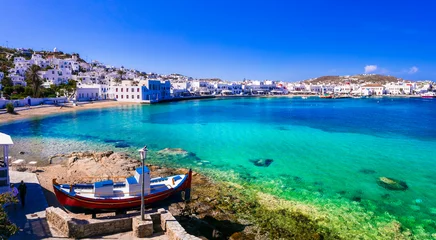 Poster Mykonos island. Greece summer holidays. Panorama of old port in downtown with turquoise sea and beach. Cyclades. © Freesurf