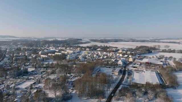 Aerial flight over Bischofswerda at a sunny winter day. Drone move forward