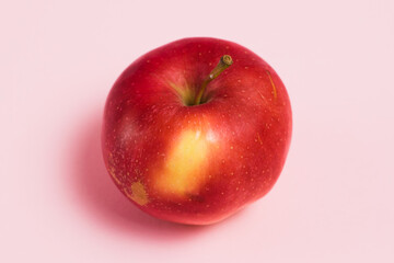 Delicious juicy apple on a pink background. Concept of earth day, zero waste and recycling