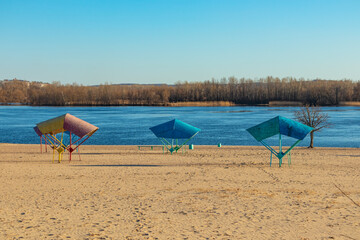 Fototapeta na wymiar Empty sandy beach on the banks of the Dnieper river in Kremenchuk city