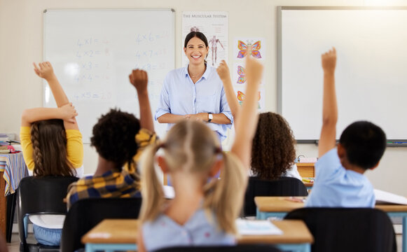 Teacher, hands up or children in classroom learning, exam or studying with preschool notebooks. Development or smart kids or young students with answers, ideas or knowledge in kindergarten or creche