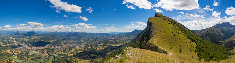Panoramic summer view of Charance Peak and the city of Gap in the Hautes-Alpes. French Alps, France