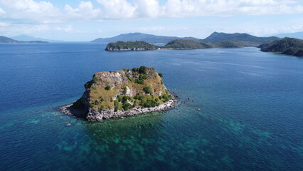 Sombrero Island. Anilao. Philippines. Small tropical island in the middle of the sea. Aerial view of an island in the ocean.