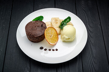 Chocolate fondant. A dessert dish call chocolate lava, include vanilla ice cream and banana.
