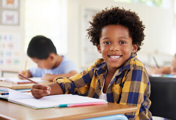 Education, drawing portrait or boy child in classroom learning, exam or studying with preschool...