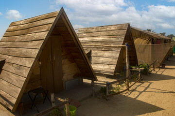 Wooden cottages of a resort just beside sea beach near Mardarmani, West Bengal. Selective focus.