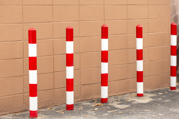 The barricades, painted in red and white, show no parking areas.