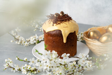 Easter cake with nest decor on gray background