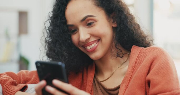 Happy, woman and smartphone on couch, lounge and reading social media post, online chat and search. Young female typing on cellphone in house, smile and download mobile games, technology and texting