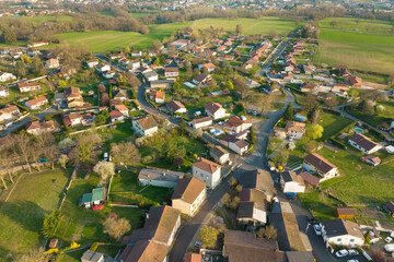 Aerial view of residential houses in green suburban rural area