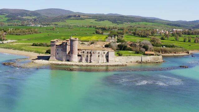 Aerial view of the Castle of Santa Severa, located in Santa Marinella in Lazio, in the Metropolitan City of Rome, Italy. It is a medieval castle built on the beach and overlooking the Tyrrhenian Sea.