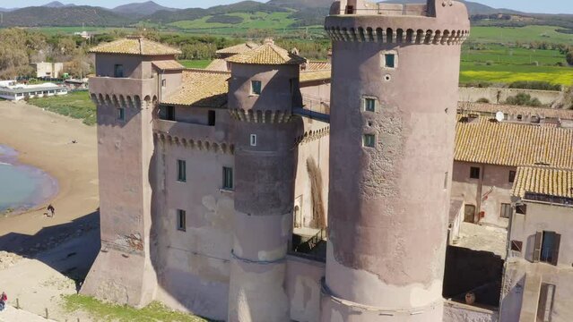 Aerial view of the Castle of Santa Severa, located in Santa Marinella in Lazio, in the Metropolitan City of Rome, Italy. It is a medieval castle built on the beach and overlooking the Tyrrhenian Sea.