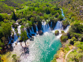 Drone aerial top down view of picturesque Kravice waterfalls in Bosnia Herzegovina.