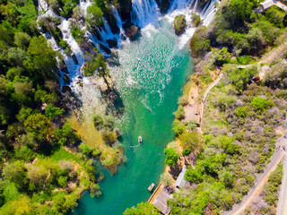 Drone aerial top down view of picturesque Kravice waterfalls in Bosnia Herzegovina.