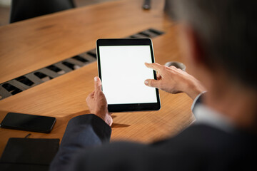 Close up of man using digital tablet.