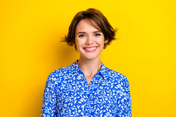 Photo of lovely charming young woman dressed blue blouse smiling isolated yellow color background
