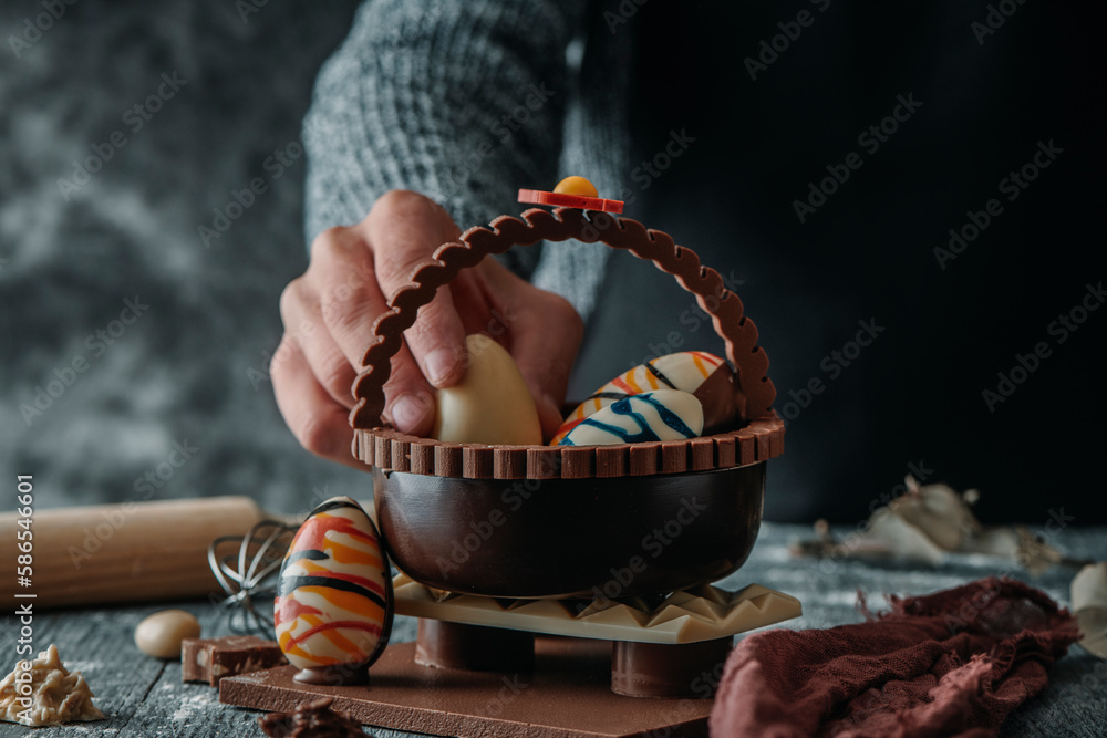 Wall mural man and chocolate basket as spanish mona de pascua