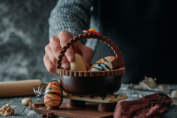 Fototapeta na wymiar man and chocolate basket as spanish mona de pascua